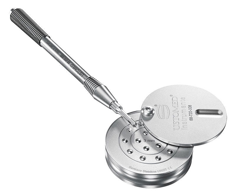 Metal tool with a threaded shaft and circular component on a white background