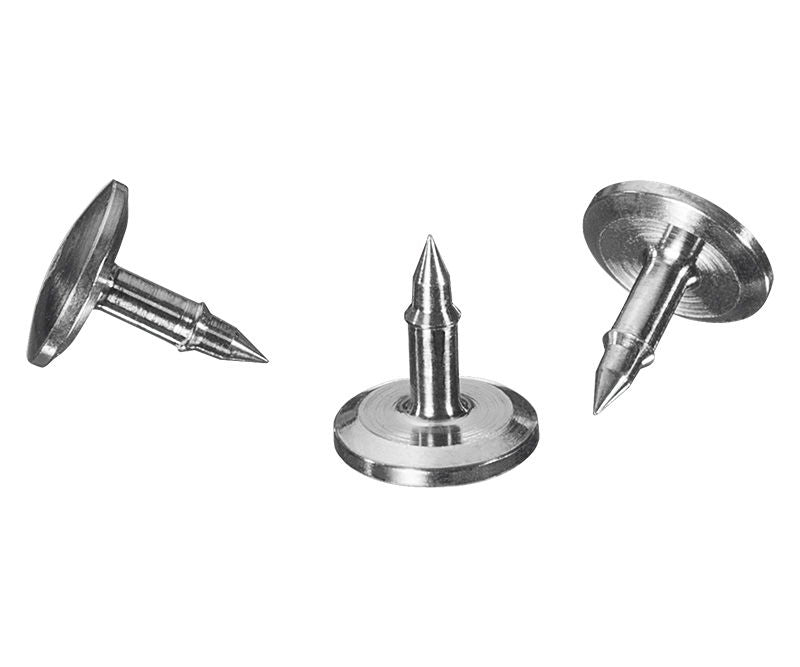 Three metal rivets on a white background